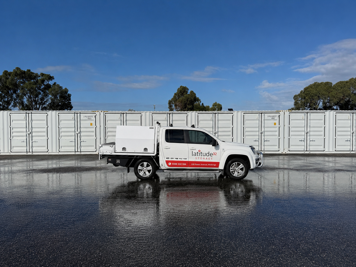 Latitude 32 Storage branded ute parked in front of shipping container bays Wattleup Perth